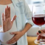pregnant-woman-refusing-glass-wine-alcohol-pregnancy-unrecognizable-expectant-lady-gestring-stop-offered-glass-wine.jpg