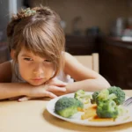 front-view-picky-girl-refuse-vegetables.webp